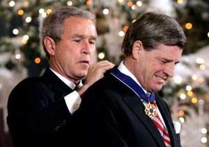 L. Paul Bremer, Eli's uncle, receives the Presidential Medal of Freedom from President Bush in 2004.