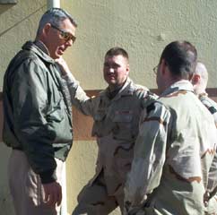 Bob Hollingsworth talks with mobilized Reservists in Moron, Spain, Jan. 31, 2003. The soldiers were enroute to Kuwait. (ESGR Photo by SFC Richard M. Arndt)