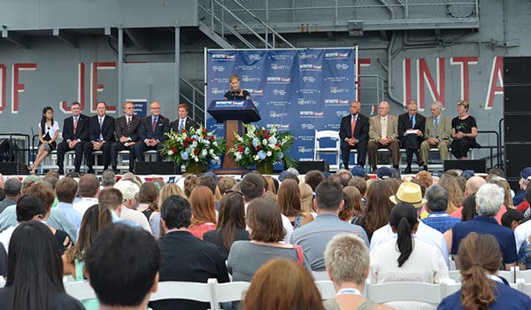 A crowd of a few hundred people attended the opening ceremony for the Intrepid's new Space Shuttle Pavilion.