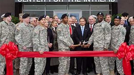 Ribbon Cutting with the Troops. at the center are Arnold Fisher, Richard Santulli (Chairman, Intrepid Fallen Heroes Fund) and Dr. Francis Harvey (Former Secretary of the Army)